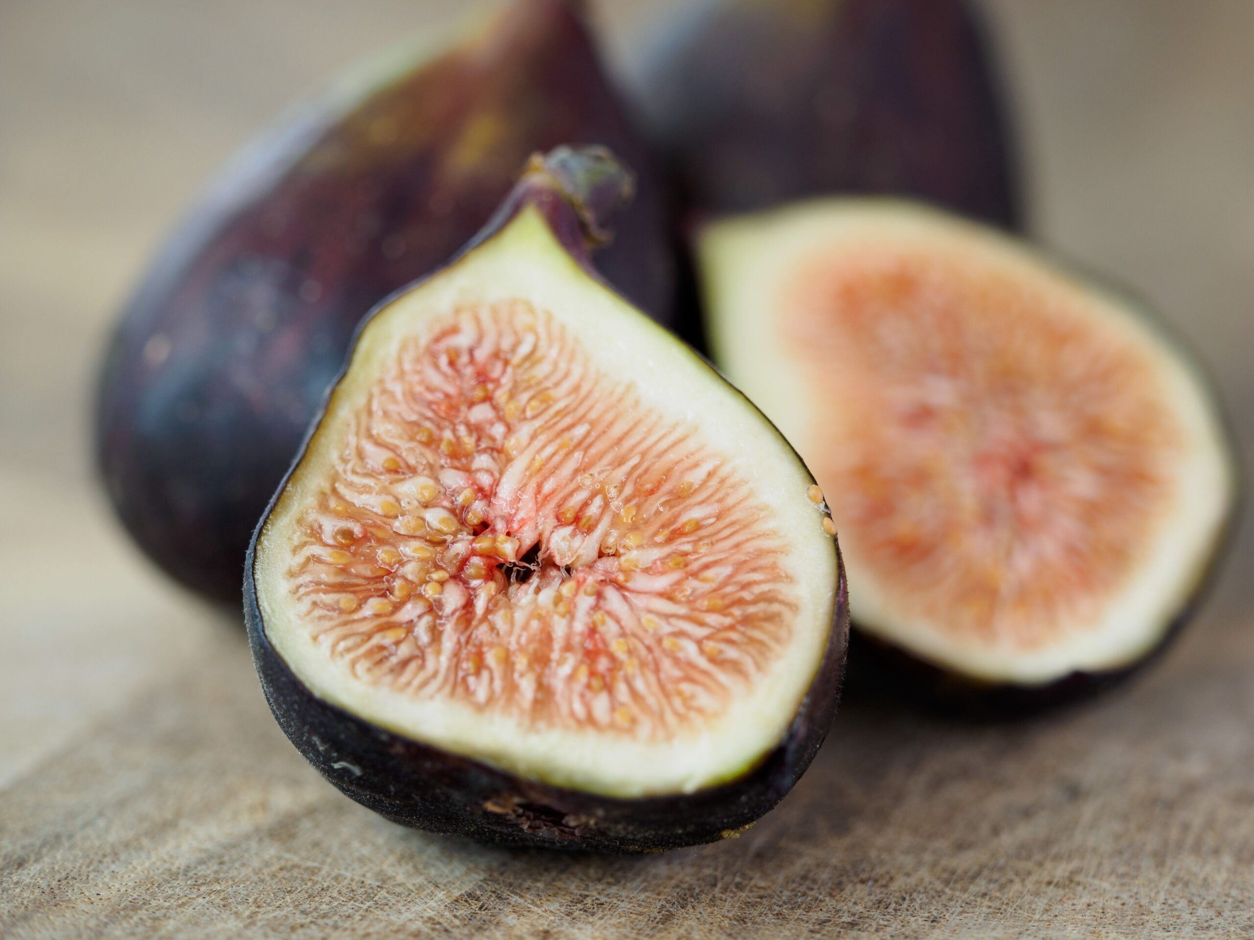 Macro shot of ripe figs showcasing intricate interior patterns, ideal for food photography.